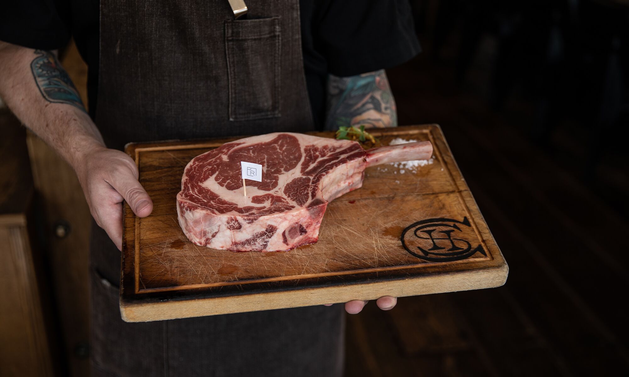 A delicious steak on a wooden cutting board at Chuck's Steakhouse in Banff, Canada.